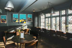 Sea Room St Ives Interior shot showing tables and windows overlooking St Ives Harbour